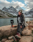 Jetboil Fuel Can Stabilizer sitting on the rocks