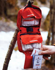 Lifesystems Camping First Aid Kit hanging on tree