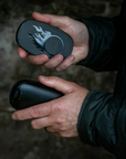 Lifesystems Dual-Palm Rechargeable Hand Warmers what they look like in a man hand