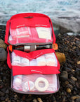 Lifesystems Mountain First Aid Kit open on the rocks