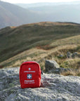 Lifesystems Pocket First Aid Kit on the rocks
