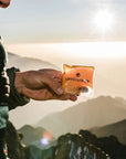 Lifesystems Reusable Hand Warmers man holding it in one hand