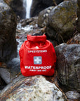 Lifesystems Waterproof First Aid Kit in the rocks