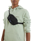 Patagonia Ultralight Black Hole Mini Hip Pack 1L (Black) model angle over shoulder