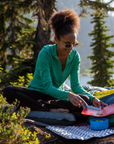 Thermarest Z Seat (Coyote Grey) women using it