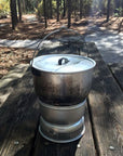 Trangia 4.5 Litre Billy Can With Lid on a bench table