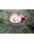 Trangia Multifuel Burner X2 Camping Stove (Red/Silver)being used