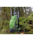 Vango Apex Air 30 Rucksack (Peridot Green) int he woods