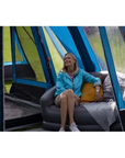 Vango Inflatable Sofa (Nocturne Grey) woman on seat
