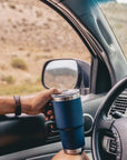 YETI Rambler 20 Oz Travel Mug (Navy) holding