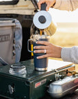 YETI Rambler 20 Oz Travel Mug (Navy) pouring