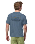 Patagonia Men’s Capilene Cool Daily Graphic Shirt (’73 Skyline: Utility Blue X-Dye) - Back On Person