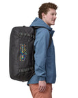 Patagonia Black Hole Duffel Bag 55L (Matte Unity Fitz: Ink Black) person