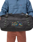 Patagonia Black Hole Duffel Bag 55L (Matte Unity Fitz: Ink Black) holding bag