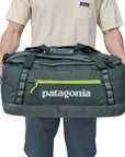 Patagonia Black Hole Duffel Bag 55L (Nouveau Green) holding