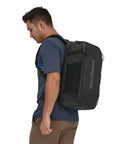 Patagonia Black Hole Mini MLC 30L (Black) model wearing angle