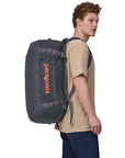 Patagonia Black Hole Duffel Bag 55L (Smoulder Blue) close up model angle