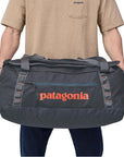 Patagonia Black Hole Duffel Bag 55L (Smoulder Blue) holding