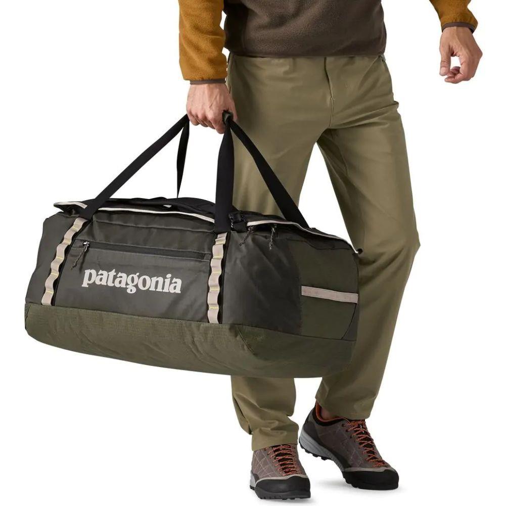 Patagonia Black Hole Duffel Bag 70L (Pine Needle Green) holding