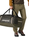 Patagonia Black Hole Duffel Bag 70L (Pine Needle Green) holding