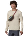 Patagonia Ultralight Black Hole Mini Hip Pack 1L (Patchwork: Pine Needle Green) over the shulders