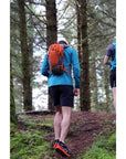 Vango Apex 15L Day Pack (Harissa) man walking up hill