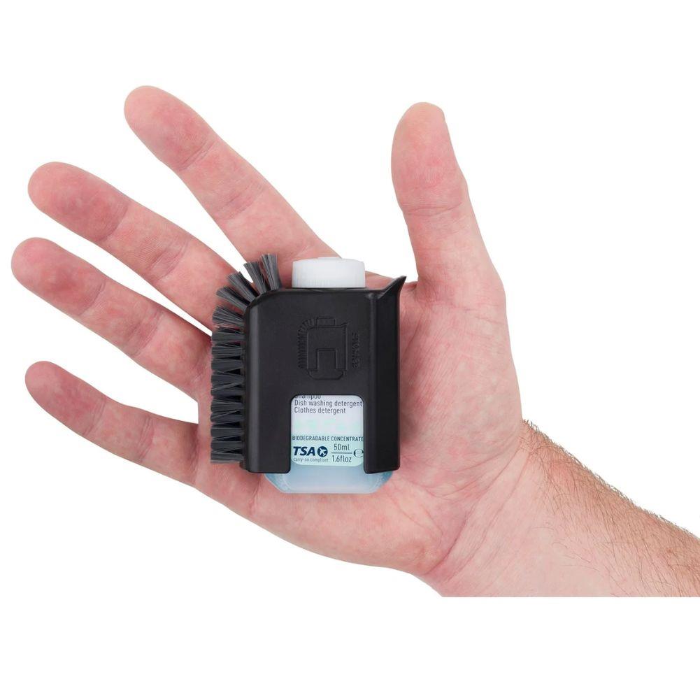 Sea to Summit Camp Kitchen Pot Scrubber and Soap (Black) in a hand