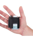 Sea to Summit Camp Kitchen Pot Scrubber and Soap (Black) in a hand