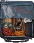 Patagonia Black Hole Cube 6L (Black) inside luggage