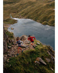 Montane Men's Featherlite Windproof Jacket (Acer Red) running along ide