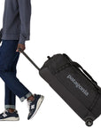 Patagonia Black Hole Wheeled Duffel Bag 100L (Black) pulling