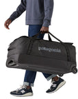 Patagonia Black Hole Wheeled Duffel Bag 100L (Black) carrying
