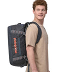 Patagonia Black Hole Duffel 40L (Matte Smolder Blue) on shoulders