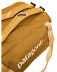 Patagonia Black Hole 55L Duffel Bag (Pufferfish Gold) straps