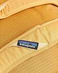Patagonia Black Hole Duffel Bag 70L (Pufferfish Gold) logo