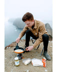 Jetboil Summit Non-Stick Camping Skillet (Orange) cooking on hill