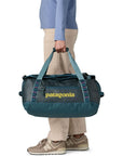 Patagonia Black Hole Duffel 40L (Tidal Teal w/Luminous Pink) holding