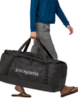 Patagonia Black Hole Duffel Bag 100L (Black/Black) walking
