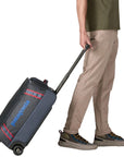 Patagonia Black Hole Wheeled Duffel 40L (Smolder Blue w/Amanita Red) walking