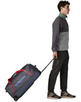 Patagonia Black Hole Wheeled Duffel 70L (Smolder Blue w/Amanita Red) walking