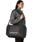 Patagonia Black Hole Mini MLC 30L (Black w/Black) over shoulder