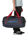 Patagonia Black Hole Duffel Bag 70L (Smolder Blue w/Amanita Red) standing