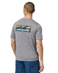 Patagonia  Men's Capilene Cool Daily Graphic Shirt - Waters (Boardshort Logo Abalone Blue: Feather Grey) angle back