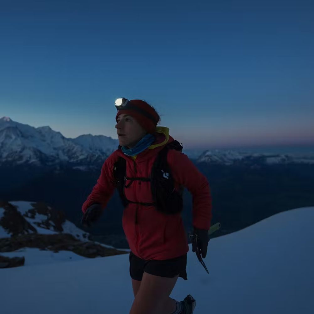 Black Diamond Distance LT 1100 Rechargeable Head Torch woman jogging in night