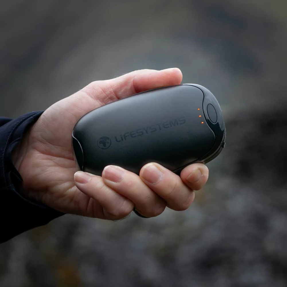 Lifesystems Dual-Palm Rechargeable Hand Warmers held in one hand