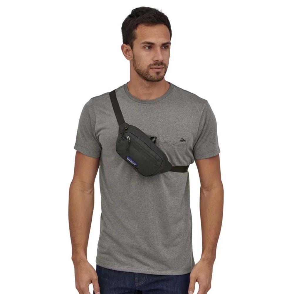 Patagonia Ultralight Black Hole Mini Hip Pack 1L (Black) model over shoulder