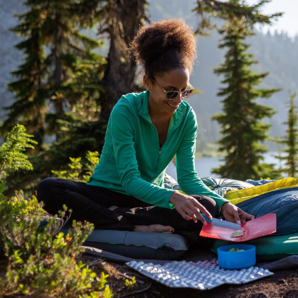 Thermarest Z Seat (Coyote Grey) women using it