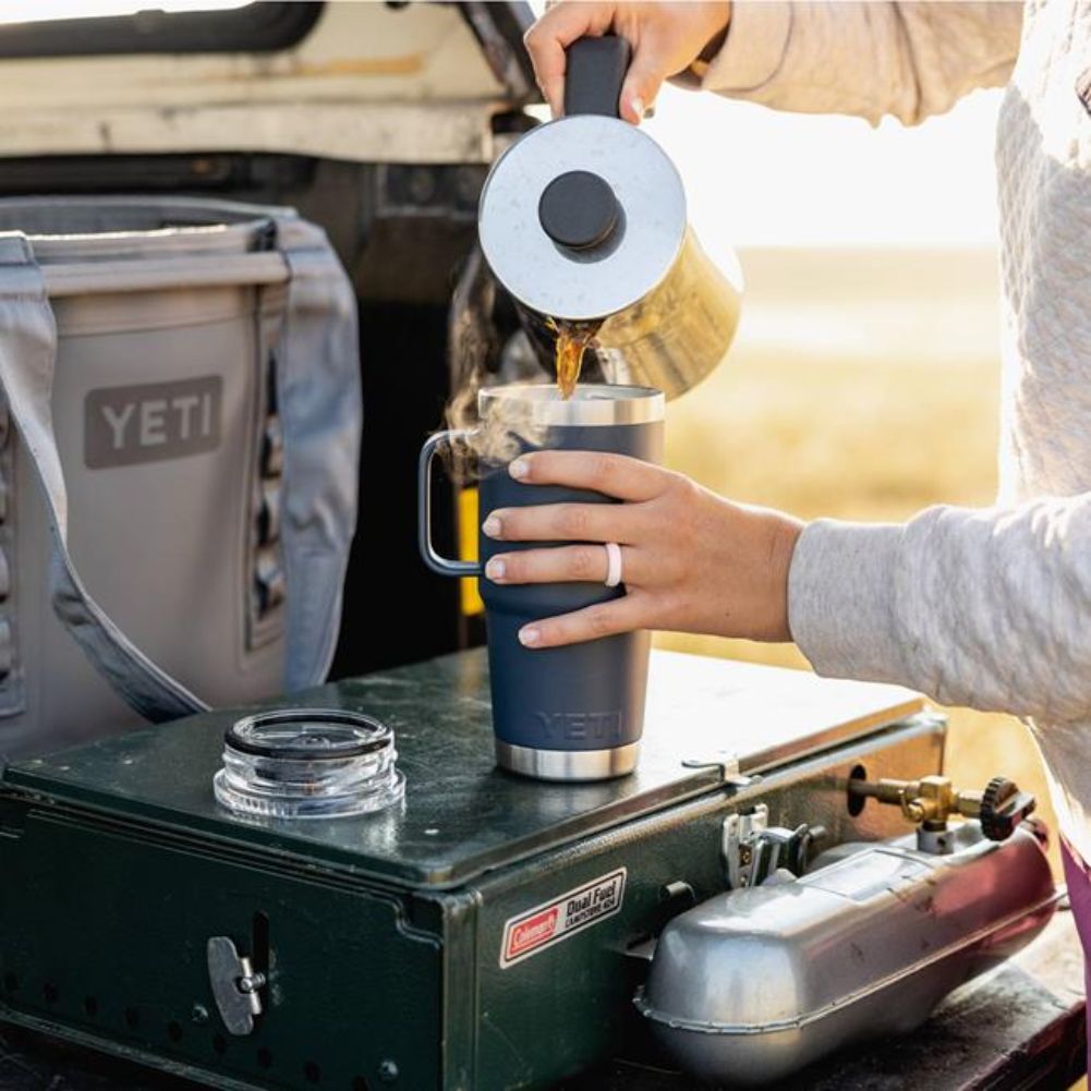 YETI Rambler 20 Oz Travel Mug (Navy) pouring