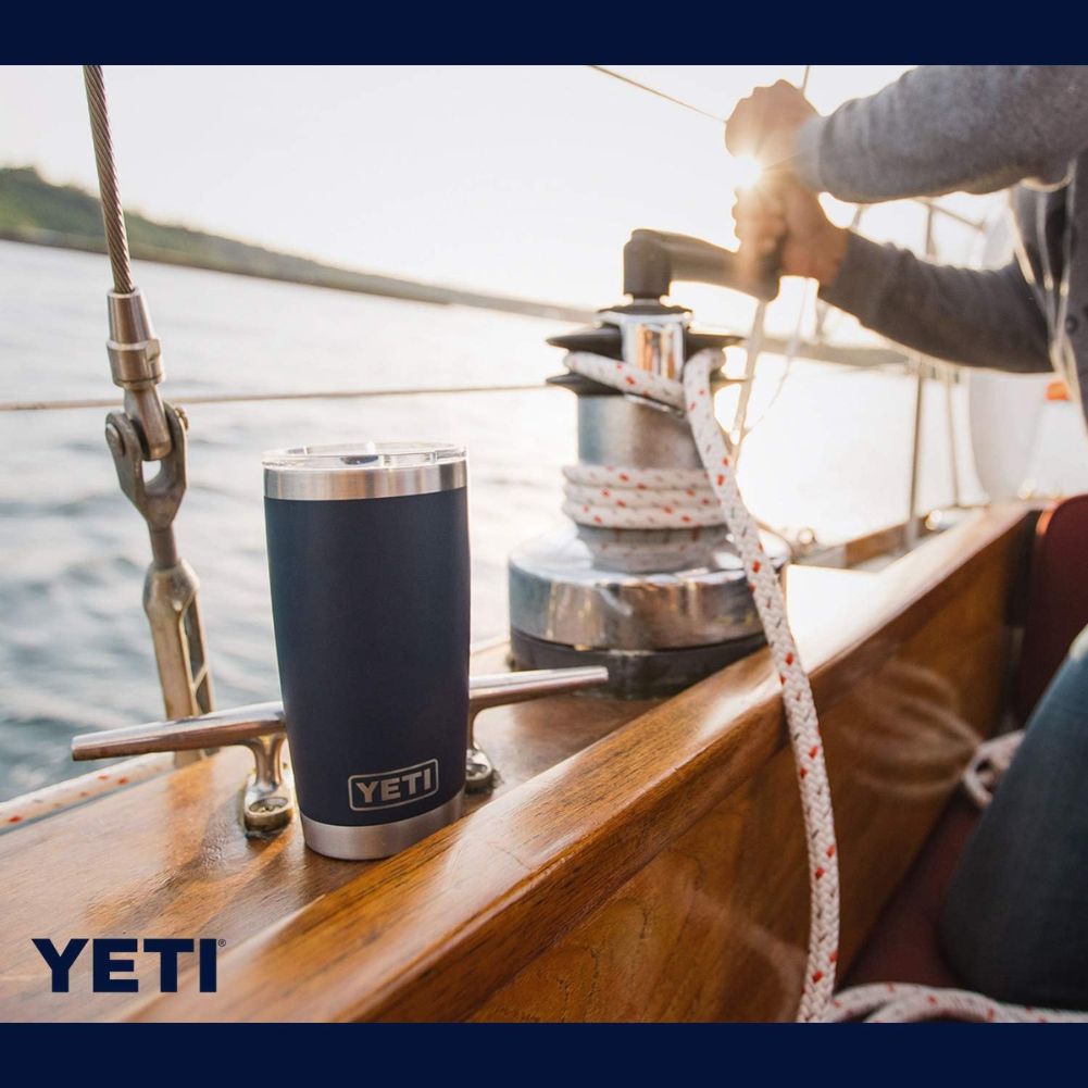 Yeti Rambler 20 OZ Tumbler (Navy) on the sea