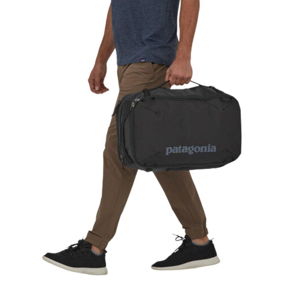 Patagonia Black Hole Mini MLC 30L (Black) walking with bag